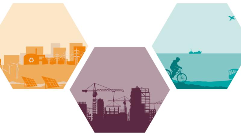 En grupp hexagonaler med en stad i bakgrunden.