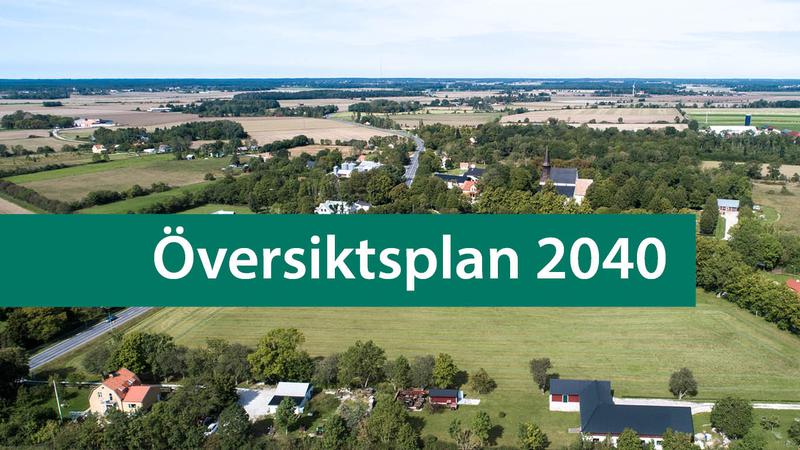 Vy över samhälle med gröna ytor och texten "Översiktsplan 2040".